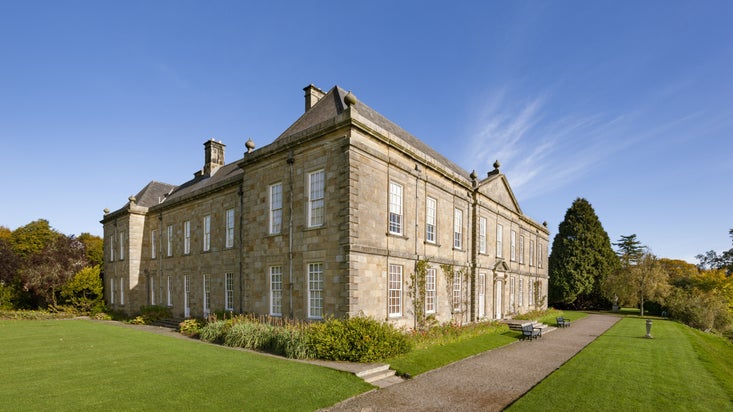 A corner view of Wallington showing the south front and side of the house